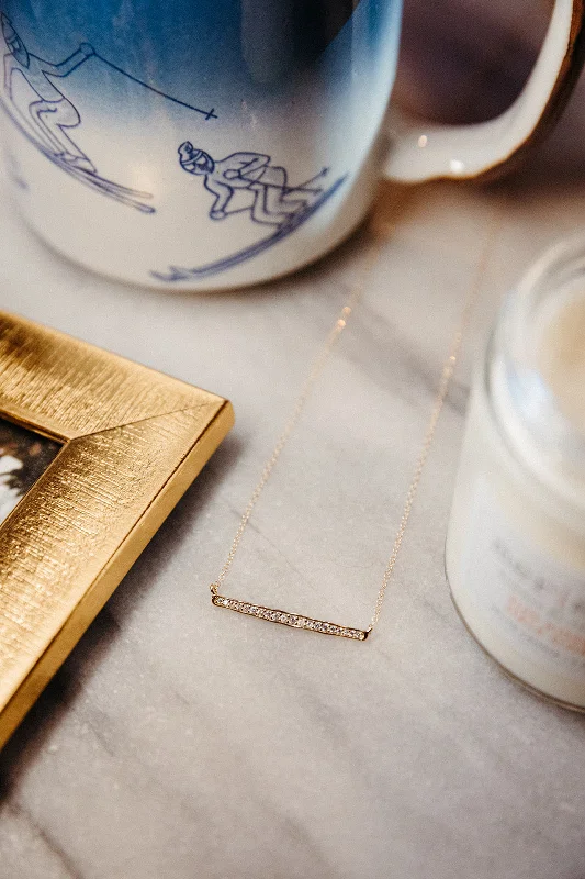 Layered pendant necklaces with different textures for an eclectic, boho-inspired style -Petite Crystal Bar Necklace